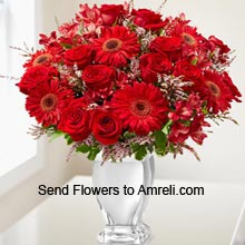 10 Red Roses And 6 Red Daisies In A Vase With Seasonal Fillers