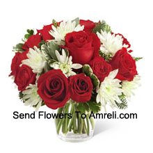 This Bouquetis a charming display of holiday beauty and winter warmth. Rich red roses and spray roses pop against white chrysanthemums, assorted Christmas greens and eucalyptus, arranged in a round clear glass vase to create a gift that will spread the goodwill of the season to your special recipient. (Please Note That We Reserve The Right To Substitute Any Product With A Suitable Product Of Equal Value In Case Of Non-Availability Of A Certain Product)