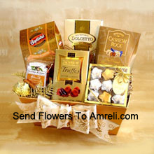 Your recipients will think they've struck gold when they receive this impressive assortment of chocolate delights. This elegantly arranged gift is perfect for those hard to please people on your list this year, and also makes a great corporate gift idea. They'll enjoy a decadent variety that includes gold and silver foil-wrapped chocolate stars, Cashew Roca, chocolate truffles, wafer cookies, chocolate squares and California almonds. We pack it all in our golden gift box and finish it with a big bow befitting the impressive selection inside. (Please Note That We Reserve The Right To Substitute Any Product With A Suitable Product Of Equal Value In Case Of Non-Availability Of A Certain Product)