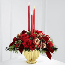 The grandeur and rich beauty of the Christmas season are highlighted with each crimson bloom. Bright red roses With Other Red Assorted Flowers and three red taper candles In A Basket to create the perfect atmosphere for their holiday celebration. (Please Note That We Reserve The Right To Substitute Any Product With A Suitable Product Of Equal Value In Case Of Non-Availability Of A Certain Product)