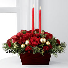 An exquisite dispay of holiday beauty to add warmth and cheer to their special celebrations. Rich red roses and burgundy mini carnations are set In A Basket To With Two Candles. (Please Note That We Reserve The Right To Substitute Any Product With A Suitable Product Of Equal Value In Case Of Non-Availability Of A Certain Product)