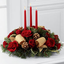 This Centerpieceis a grand display of holiday elegance. Red roses and And Other Assorted Flowers pop against a backdrop of assorted holiday greens and variegated holly that beautifully encircle three red taper candles. Ths centerpiece creates a warm and enchanting glow to benefit their holiday festivities. (Please Note That We Reserve The Right To Substitute Any Product With A Suitable Product Of Equal Value In Case Of Non-Availability Of A Certain Product)